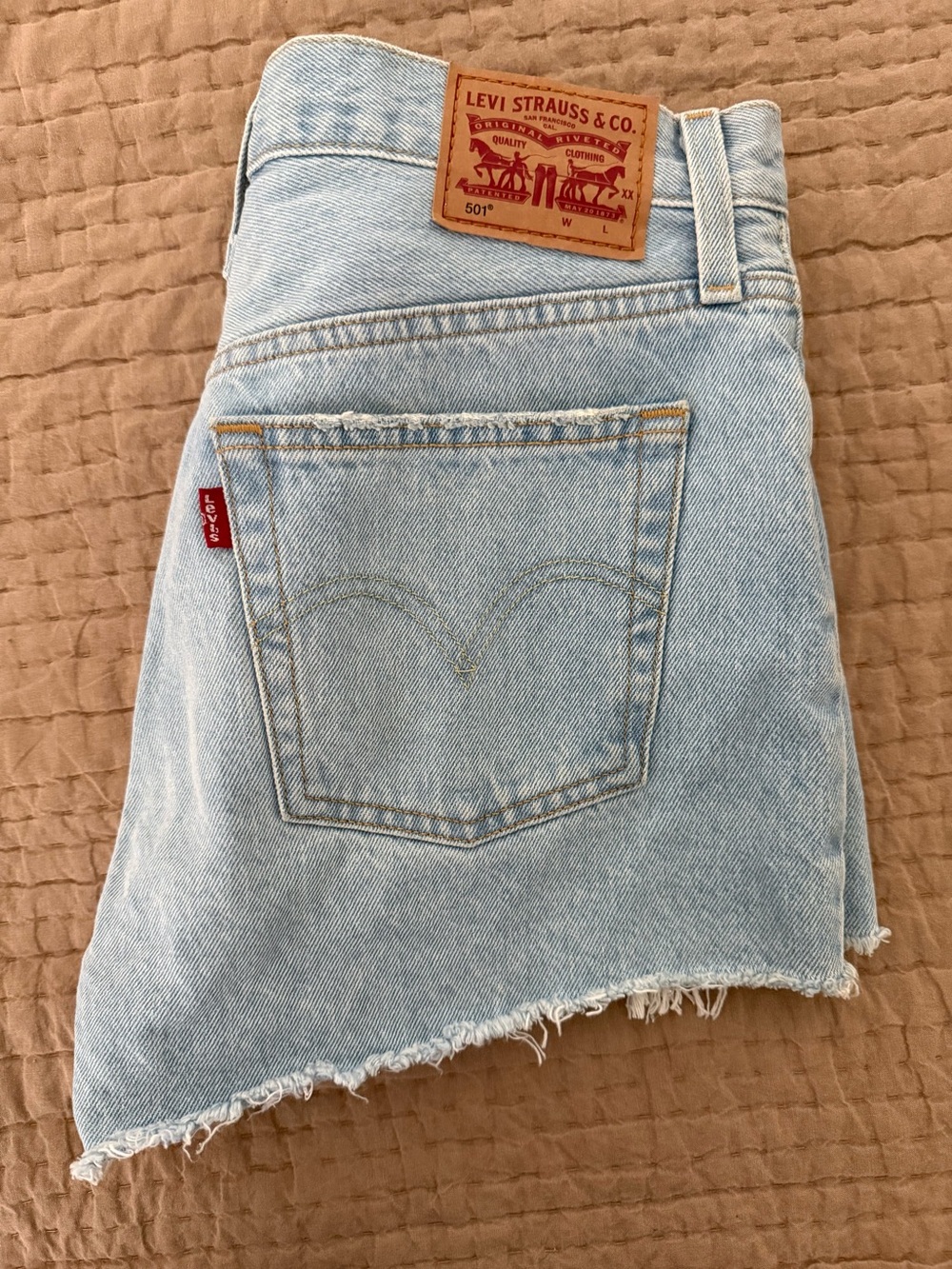 Levi's Light Blue Denim 501 Jean Shorts with Raw Hem and distressing